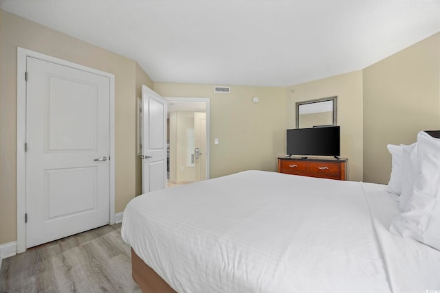 201 S Ocean Blvd Unit 1005, Myrtle Beach, SC 29577 - bedroom with baseboards, light wood finished floors, and visible vents