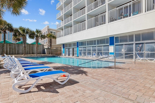 201 S Ocean Blvd Unit 1005, Myrtle Beach, SC 29577 - community pool featuring a patio and fence