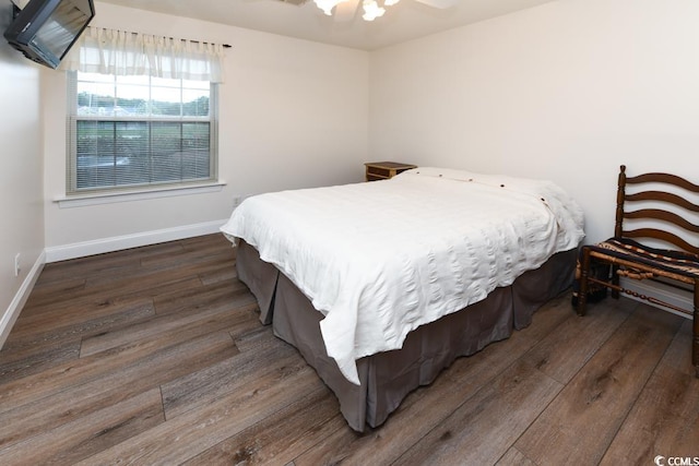 bedroom featuring hardwood / wood-style floors and ceiling fan