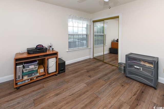 misc room featuring dark hardwood / wood-style flooring and ceiling fan