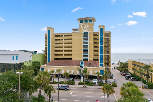 view of building exterior with a water view