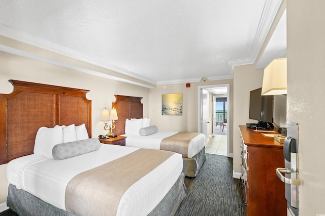 bedroom featuring a textured ceiling and crown molding