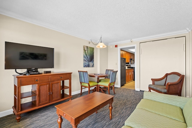 living room featuring dark carpet, a textured ceiling, and ornamental molding