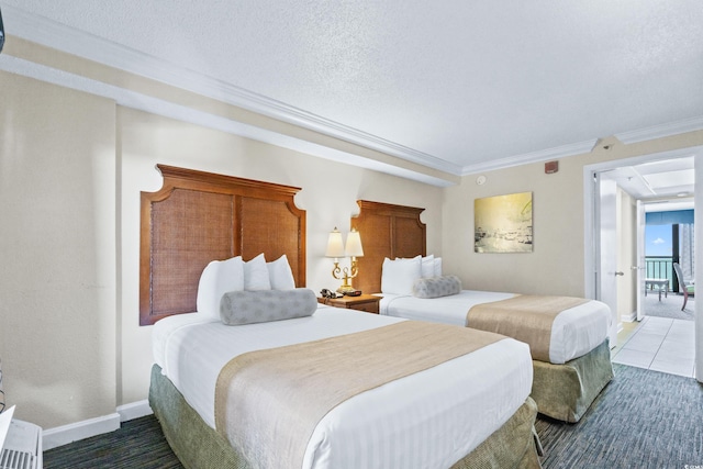 bedroom featuring a textured ceiling and ornamental molding