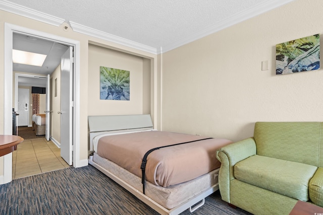 bedroom featuring a textured ceiling, tile patterned flooring, and ornamental molding