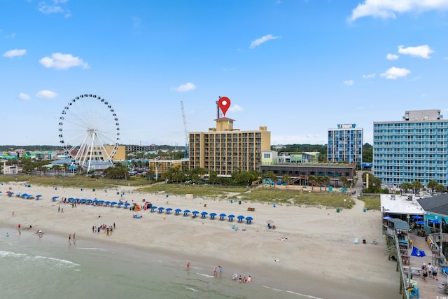 aerial view featuring a water view and a view of the beach