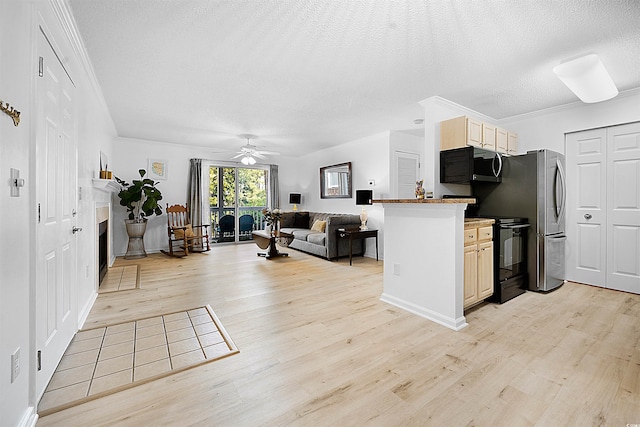 kitchen with a textured ceiling, light hardwood / wood-style flooring, crown molding, and black electric range