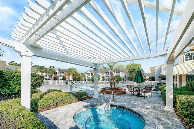 view of swimming pool with a pergola, a patio area, and a hot tub