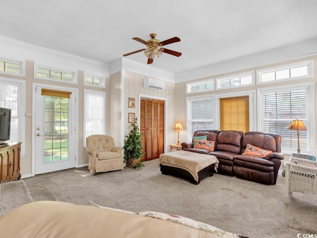 living room featuring light carpet, a wall mounted air conditioner, and ceiling fan