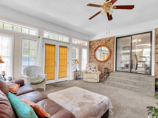 living room featuring ceiling fan, carpet, a textured ceiling, and french doors