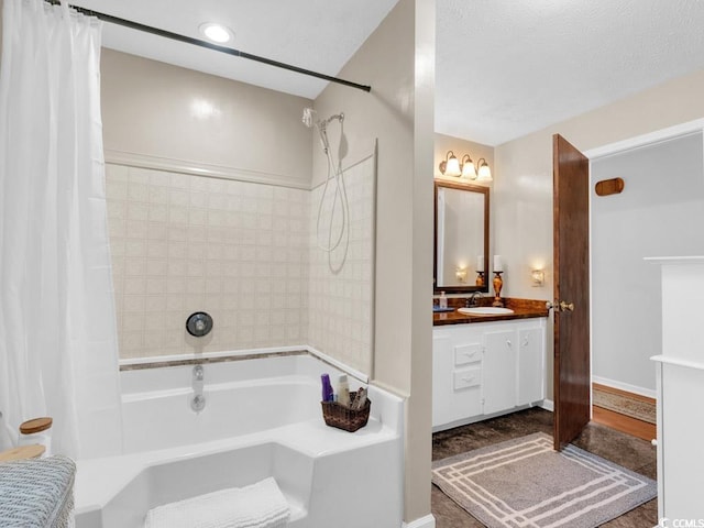 bathroom with vanity and shower / bath combination with curtain