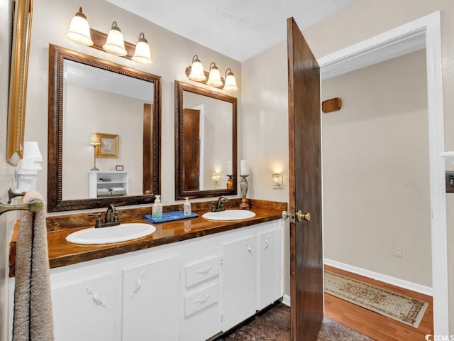 bathroom with vanity and hardwood / wood-style floors