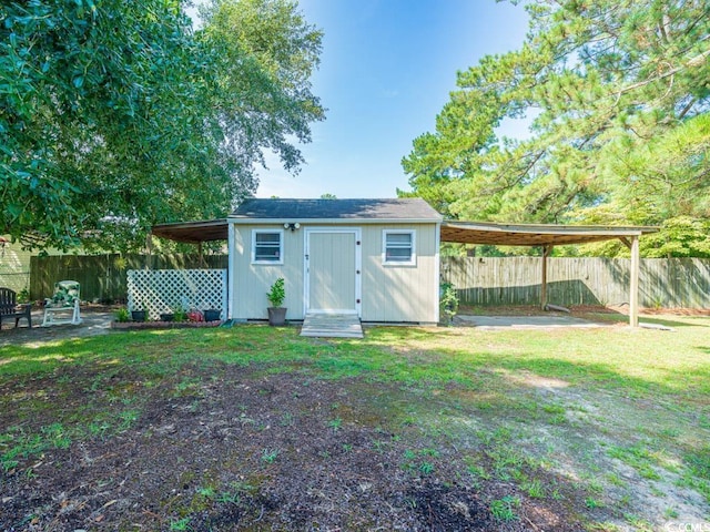 view of outbuilding with a lawn