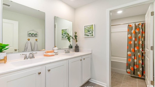 bathroom featuring shower / bath combo, vanity, and tile patterned floors