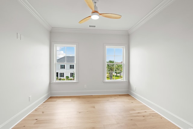 spare room with crown molding, light hardwood / wood-style flooring, and ceiling fan