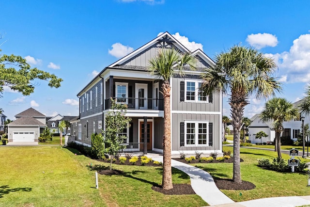 view of front facade featuring covered porch, board and batten siding, a front yard, and a balcony