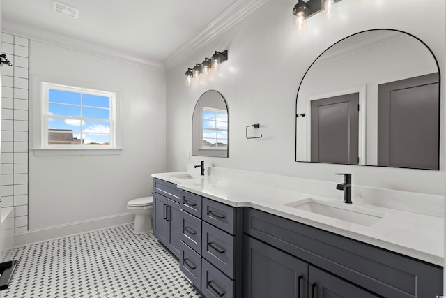 bathroom with double vanity, visible vents, toilet, crown molding, and a sink