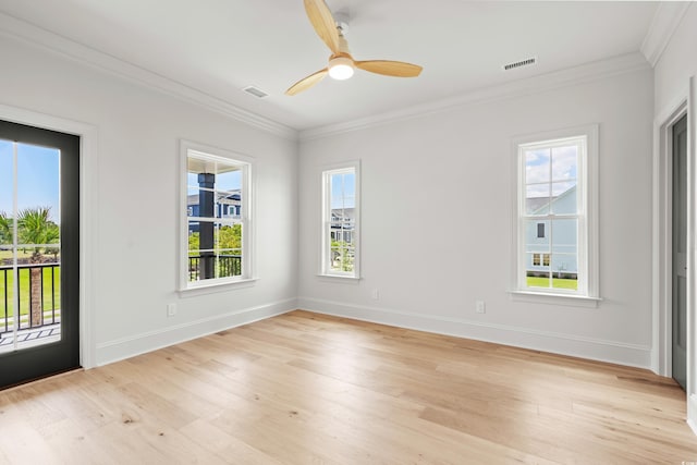 empty room featuring ceiling fan, ornamental molding, and light hardwood / wood-style flooring