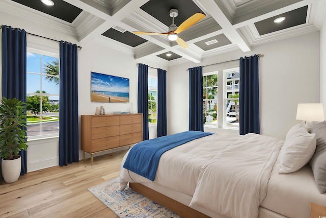 bedroom with crown molding, coffered ceiling, light wood-type flooring, and ceiling fan