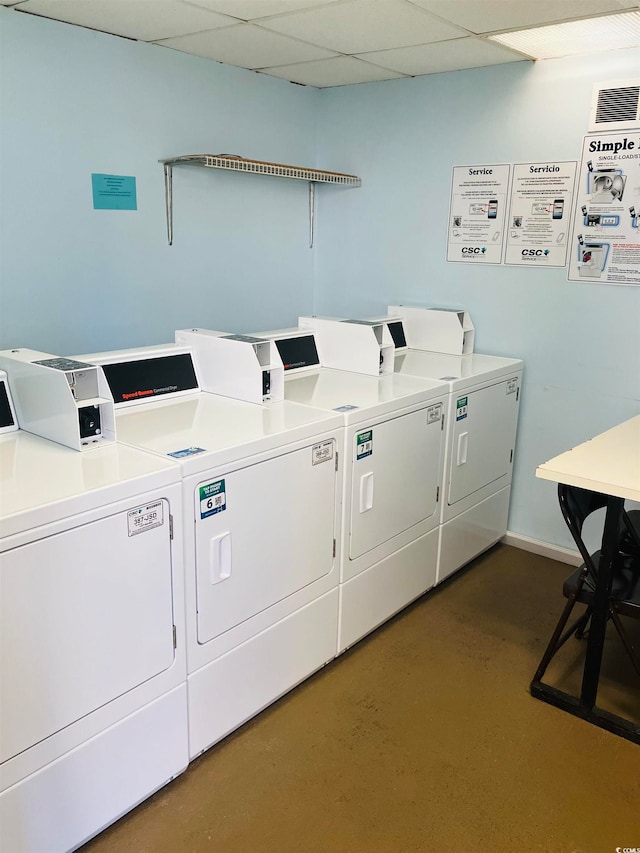 washroom featuring washing machine and clothes dryer