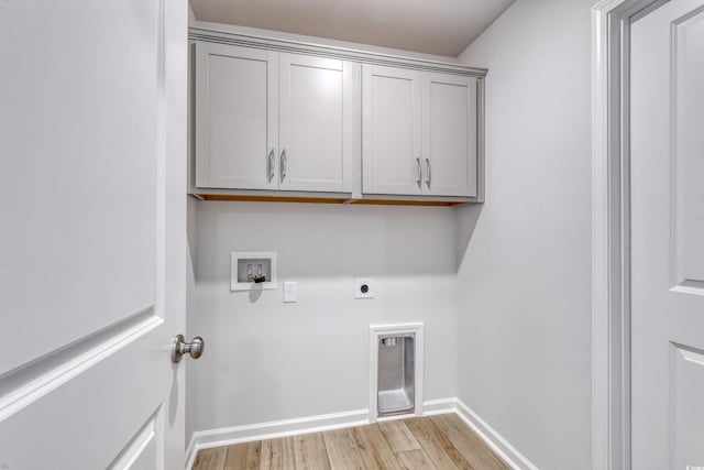 laundry area featuring hookup for a washing machine, baseboards, light wood finished floors, cabinet space, and electric dryer hookup