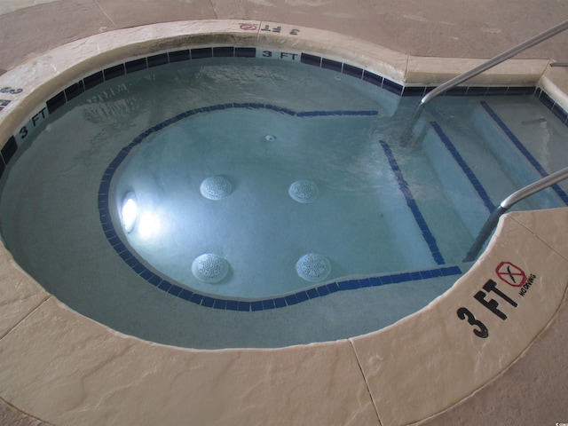 exterior space featuring an indoor in ground hot tub