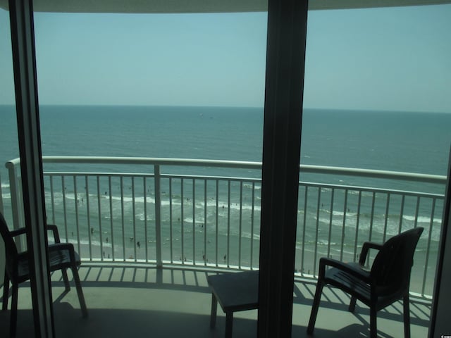 balcony featuring a water view