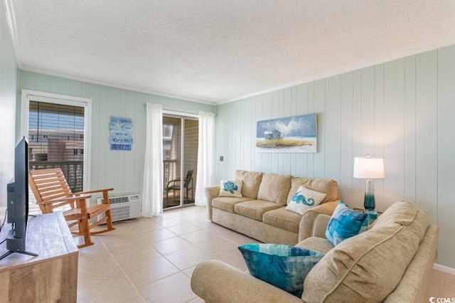 living room featuring light tile patterned flooring and a textured ceiling