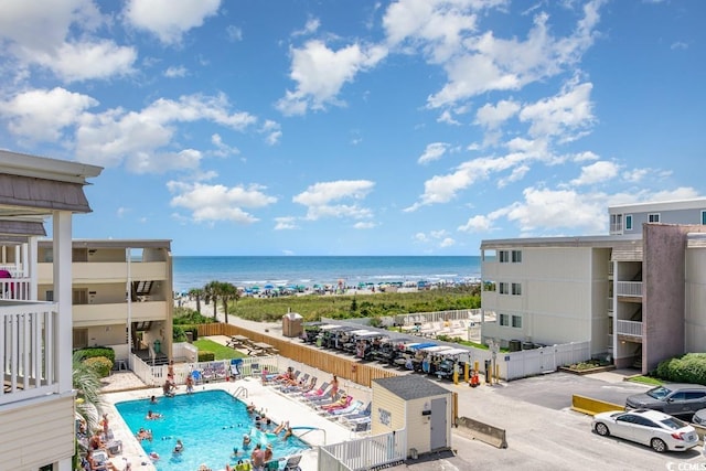 view of swimming pool featuring a water view