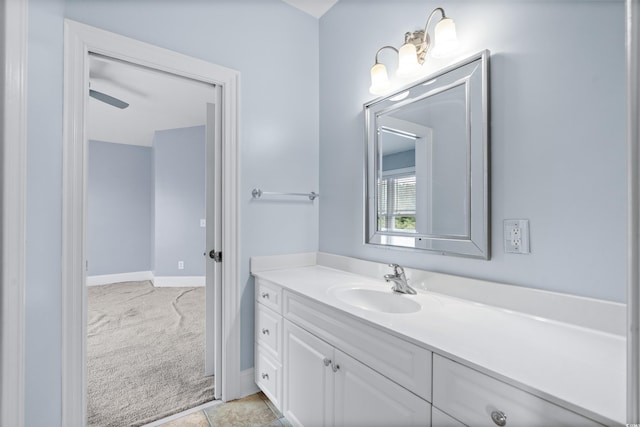 bathroom with ceiling fan, tile patterned flooring, and vanity