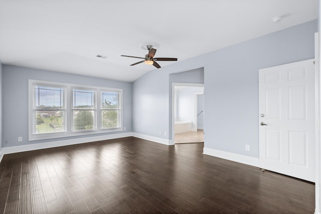 spare room with ceiling fan, dark hardwood / wood-style floors, and lofted ceiling