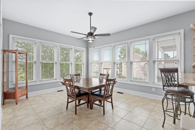 sunroom with ceiling fan