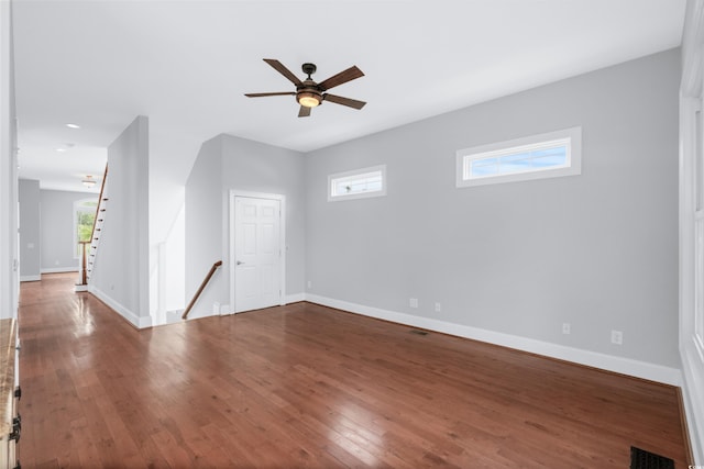 unfurnished room with hardwood / wood-style flooring and ceiling fan