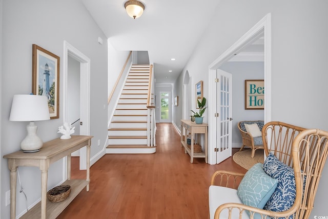 entryway featuring stairway, french doors, baseboards, recessed lighting, and wood finished floors