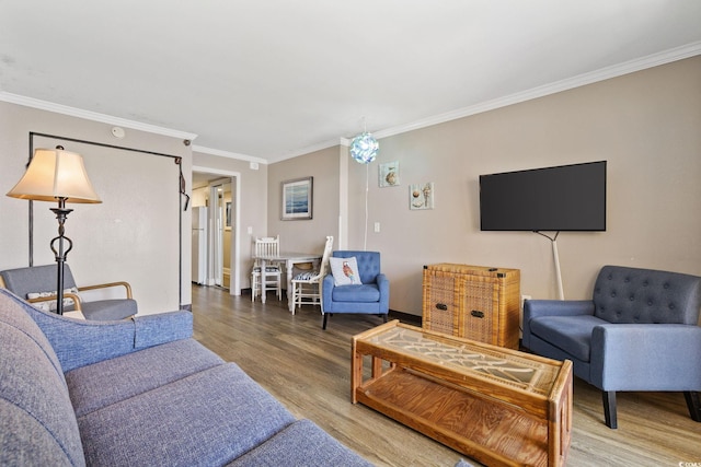 living room featuring ornamental molding and hardwood / wood-style flooring