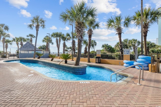 view of swimming pool featuring a patio