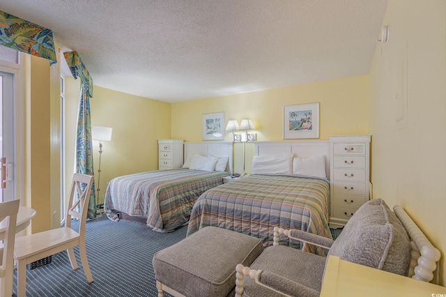 2701 S Ocean Blvd Unit 710, North Myrtle Beach, SC 29582 - bedroom with carpet flooring and a textured ceiling