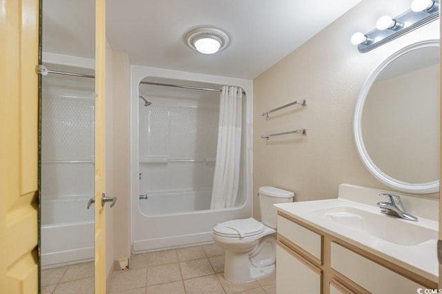 full bathroom with tile patterned floors, shower / bath combo, toilet, and vanity