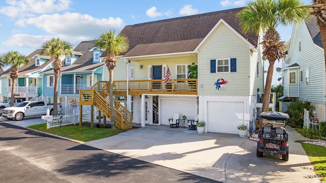 view of front facade with a garage and a porch