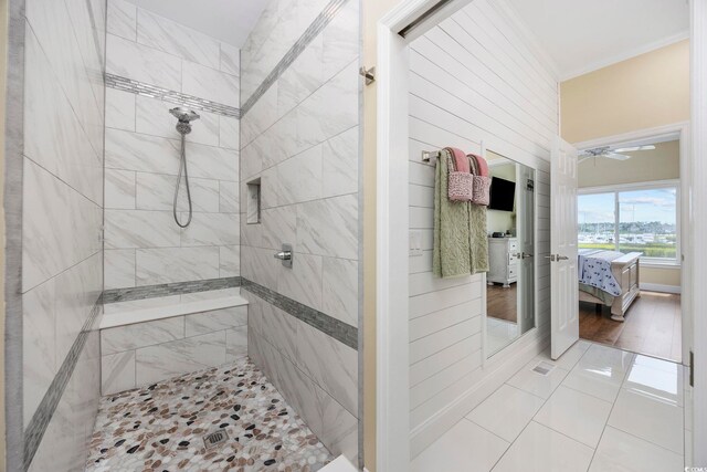4524 Landing Rd, Little River, SC 29566 - ensuite bathroom with a tile shower, crown molding, tile patterned floors, and a ceiling fan