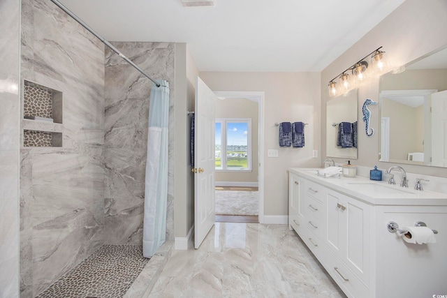 bathroom with vanity and walk in shower