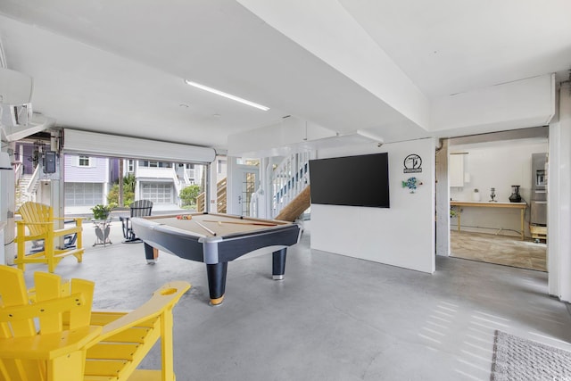 rec room featuring billiards and concrete flooring