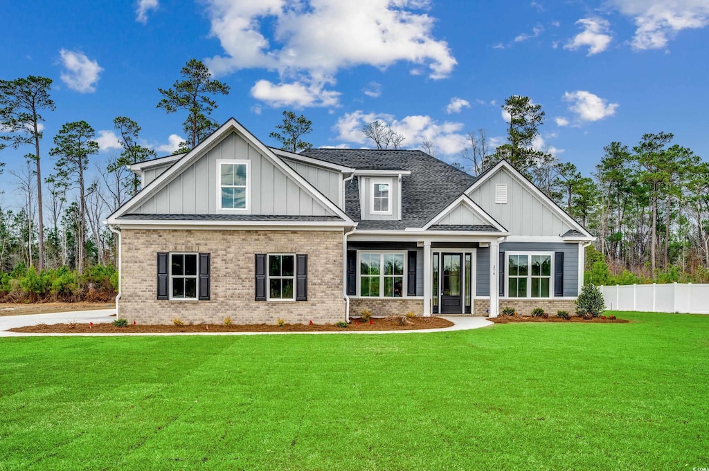 craftsman house with a front lawn