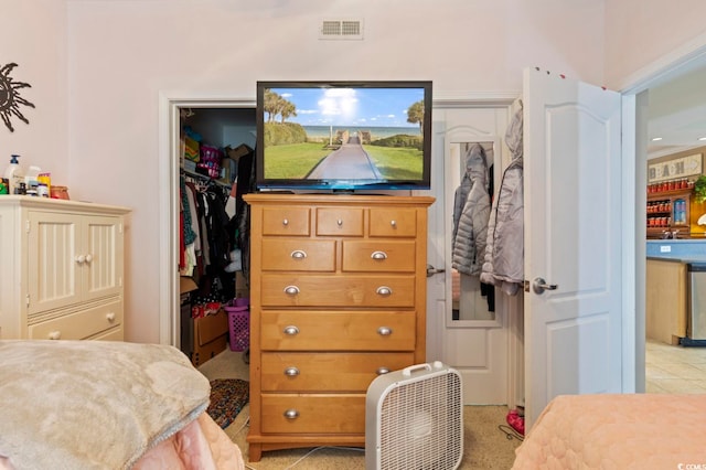 carpeted bedroom with a closet