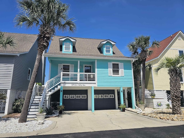 view of front of house with a garage and a porch