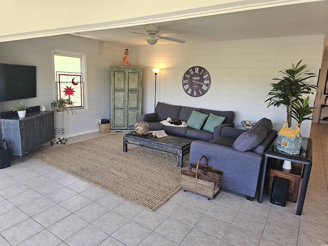 tiled living room featuring ceiling fan