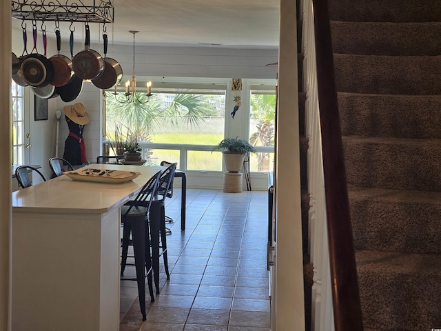 dining area with an inviting chandelier