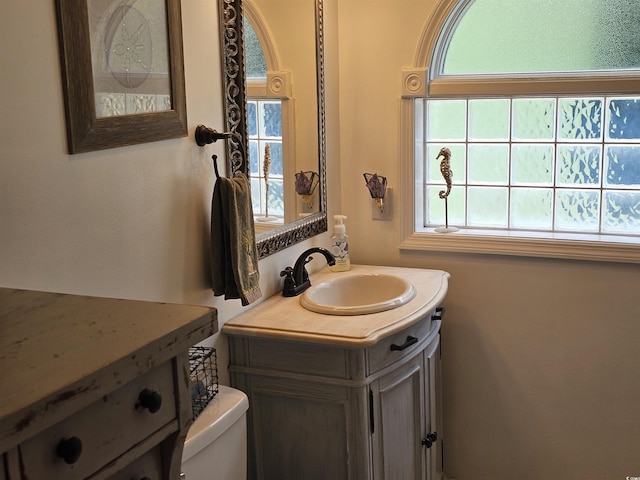 bathroom with vanity and toilet