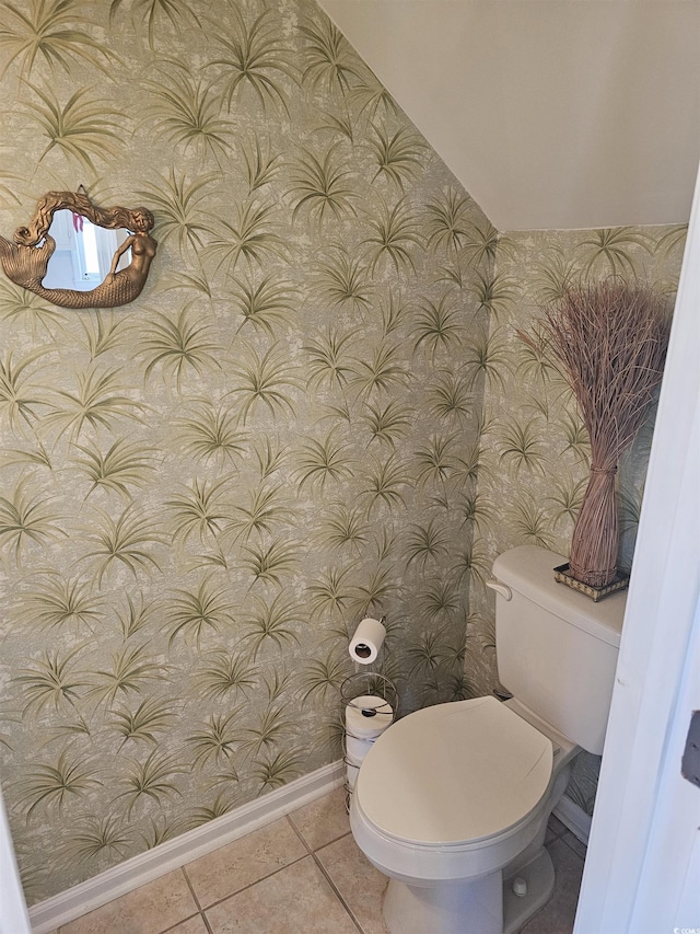 bathroom featuring tile patterned flooring and toilet