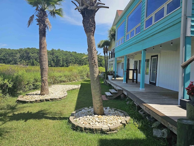 view of yard with a wooden deck